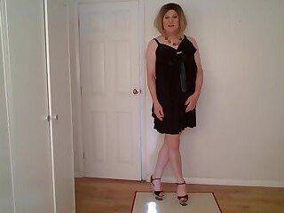 Little black dress, G-string and stripper heels - ashemaletube.com