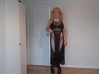 Dominatrix in black boots, see through outfit and whip - ashemaletube.com