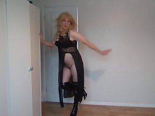 Dominatrix in black boots, see through outfit and whip - ashemaletube.com