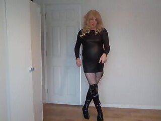 Leather dress, fishnets, boots and whip - ashemaletube.com