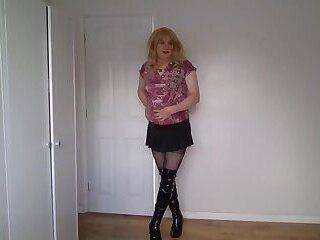 Blonde in black pantyhose and miniskirt - ashemaletube.com