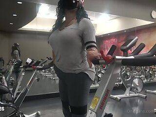 Stroking her big cock in the gym and shooting a cumshot - ashemaletube.com